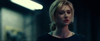 Movie still from “Widows” (2018), directed by Steve McQueen – A woman with blonde hair is looking to her left; Close Up shot, Over the shoulder angle