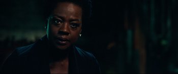 Movie still from “Widows” (2018), directed by Steve McQueen – A person wearing a black jacket; Close Up shot, Over the shoulder angle