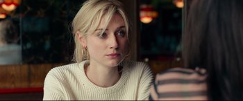 Movie still from “Widows” (2018), directed by Steve McQueen – A person sitting in a room; Close Up shot, Over the shoulder angle