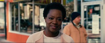 Movie still from “Widows” (2018), directed by Steve McQueen – A person wearing a jacket; Close Up shot, Over the shoulder angle