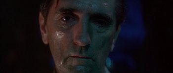 Movie still from “Wild at Heart” (1990), directed by David Lynch – A man's face with water on his face; Close Up shot, Low angle