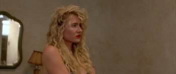 Movie still from “Wild at Heart” (1990), directed by David Lynch – A woman with long blonde hair and red lipstick; Close Up shot, Over the shoulder angle