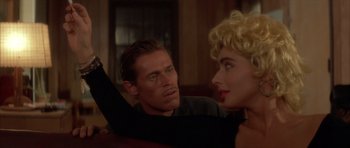 Movie still from “Wild at Heart” (1990), directed by David Lynch – A man and a woman are sitting in front of each other; Close Up shot, Over the shoulder angle