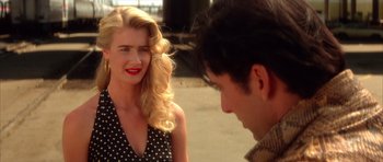 Movie still from “Wild at Heart” (1990), directed by David Lynch – A man and a woman talking to each other outside; Close Up shot, Over the shoulder angle