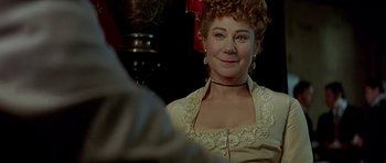 Movie still from “Wilde” (1997), directed by Brian Gilbert – A person wearing a dress; Close Up shot, Over the shoulder angle