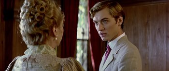 Movie still from “Wilde” (1997), directed by Brian Gilbert – A man and a woman are looking at one another; Close Up shot, Over the shoulder angle