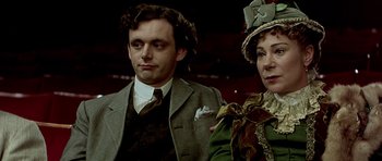 Movie still from “Wilde” (1997), directed by Brian Gilbert – A man and a woman standing next to each other; Close Up shot, High angle