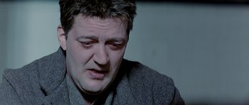 Movie still from “Wilde” (1997), directed by Brian Gilbert – A person with his eyes wide open; Close Up shot, High angle