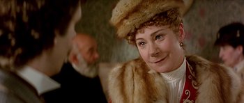 Movie still from “Wilde” (1997), directed by Brian Gilbert – A person wearing a hat; Close Up shot, Over the shoulder angle