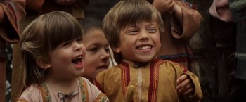 Movie still from “Willow” (1988), directed by Ron Howard – A group of children standing next to each other; Close Up shot, High angle