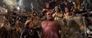 Movie still from “Willow” (1988), directed by Ron Howard – A group of people standing in a room; Medium shot, High angle