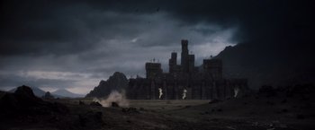 Movie still from “Willow” (1988), directed by Ron Howard – A dark sky with a castle in the background; Extreme Wide shot, High angle