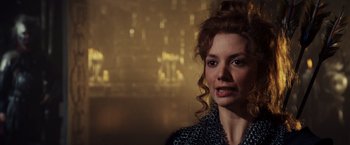 Movie still from “Willow” (1988), directed by Ron Howard – A person wearing a dress; Close Up shot, Over the shoulder angle