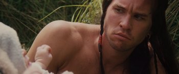 Movie still from “Willow” (1988), directed by Ron Howard – A person wearing a necklace; Close Up shot, Over the shoulder angle