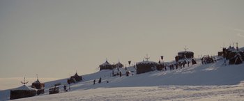 Movie still from “Willow” (1988), directed by Ron Howard – A group of skiers on a snow covered slope; Extreme Wide shot, Low angle