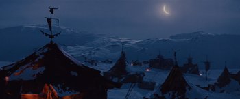 Movie still from “Willow” (1988), directed by Ron Howard – A full moon is setting over a snowy mountain; Extreme Wide shot, Low angle