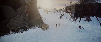 Movie still from “Willow” (1988), directed by Ron Howard – A group of skiers on a snowy slope; Extreme Wide shot, High angle
