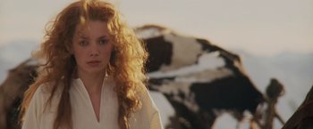 Movie still from “Willow” (1988), directed by Ron Howard – A beautiful young woman with long red hair; Close Up shot, Low angle
