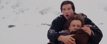 Movie still from “Willow” (1988), directed by Ron Howard – A man and a woman in the middle of a snow covered field; Medium shot, Low angle