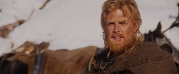 Movie still from “Willow” (1988), directed by Ron Howard – A person with long hair and a beard; Close Up shot, Low angle