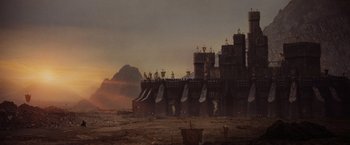 Movie still from “Willow” (1988), directed by Ron Howard – An image of a castle in the middle of the desert; Extreme Wide shot, Low angle