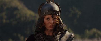 Movie still from “Willow” (1988), directed by Ron Howard – A person wearing a helmet; Close Up shot, Low angle