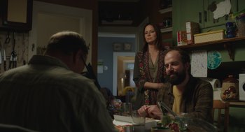 Movie still from “Wilson” (2017), directed by Craig Johnson – A man and a woman sitting at a dinner table; Medium shot, Over the shoulder angle