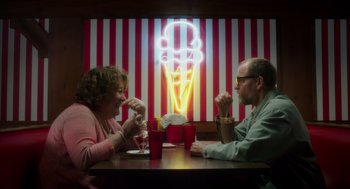 Movie still from “Wilson” (2017), directed by Craig Johnson – A man and a woman sitting at a table eating ice cream; Medium shot, Over the shoulder angle