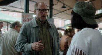 Movie still from “Wilson” (2017), directed by Craig Johnson – An older man talking to a woman in a crowd; Medium shot, Over the shoulder angle