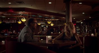 Movie still from “Wilson” (2017), directed by Craig Johnson – A man and a woman are sitting at a table; Medium shot, Over the shoulder angle