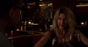 Movie still from “Wilson” (2017), directed by Craig Johnson – A woman sitting at a table in a restaurant; Close Up shot, Over the shoulder angle