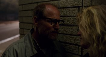 Movie still from “Wilson” (2017), directed by Craig Johnson – A man with a goatee and glasses is looking at a woman; Close Up shot, Over the shoulder angle