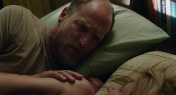 Movie still from “Wilson” (2017), directed by Craig Johnson – A man laying in bed next to a sleeping woman; Close Up shot, Over the shoulder angle