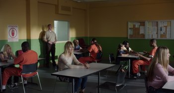 Movie still from “Wilson” (2017), directed by Craig Johnson – A group of people sitting at a table in a room; Wide shot, Over the shoulder angle