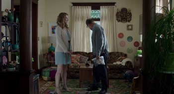 Movie still from “Wilson” (2017), directed by Craig Johnson – A man and a woman standing in a living room; Wide shot, Over the shoulder angle