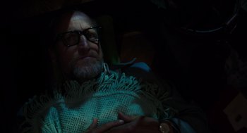Movie still from “Wilson” (2017), directed by Craig Johnson – An older man wearing glasses is sitting in a chair; Close Up shot, Overhead angle