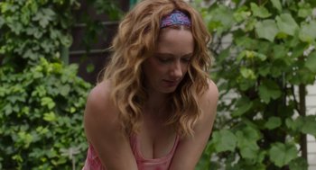 Movie still from “Wilson” (2017), directed by Craig Johnson – A woman sitting in front of a bush with her hands crossed; Close Up shot, Over the shoulder angle