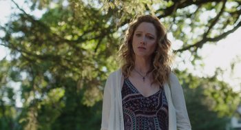 Movie still from “Wilson” (2017), directed by Craig Johnson – A woman standing in front of a tree looking to her left; Close Up shot, Low angle