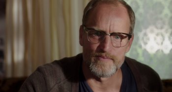 Movie still from “Wilson” (2017), directed by Craig Johnson – A person with a beard wearing glasses; Close Up shot, Over the shoulder angle