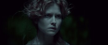 Movie still from “Winchester” (2018), directed by Michael Spierig – A person wearing a white shirt; Close Up shot, Low angle