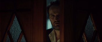 Movie still from “Winchester” (2018), directed by Michael Spierig – A person with a beard; Close Up shot, Low angle