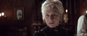 Movie still from “Winchester” (2018), directed by Michael Spierig – An older woman with white hair looking at the camera; Close Up shot, Low angle