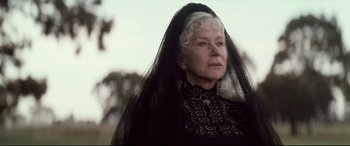 Movie still from “Winchester” (2018), directed by Michael Spierig – An older woman wearing a black dress and a veil; Close Up shot, Low angle