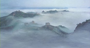 Movie still from “Winged Migration” (2001), directed by Jacques Cluzaud – The great wall of china in the middle of the morning fog; Extreme Wide shot, High angle