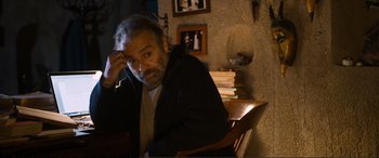 Movie still from “Winter Sleep” (2014), directed by Nuri Bilge Ceylan – An older man sitting in a chair in a room; Medium shot, High angle