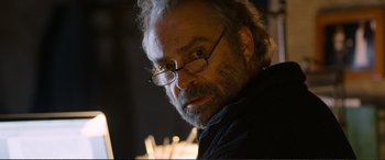 Movie still from “Winter Sleep” (2014), directed by Nuri Bilge Ceylan – An older man wearing glasses and a sweater; Close Up shot, Low angle