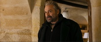 Movie still from “Winter Sleep” (2014), directed by Nuri Bilge Ceylan – A person wearing a jacket; Close Up shot, Over the shoulder angle