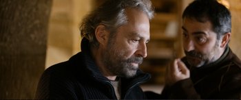 Movie still from “Winter Sleep” (2014), directed by Nuri Bilge Ceylan – A person wearing a jacket; Close Up shot, Low angle