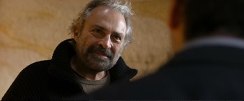 Movie still from “Winter Sleep” (2014), directed by Nuri Bilge Ceylan – An older man with grey hair looking at the camera; Close Up shot, Over the shoulder angle