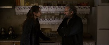 Movie still from “Winter Sleep” (2014), directed by Nuri Bilge Ceylan – A man and a woman standing in a kitchen talking; Medium shot, Over the shoulder angle